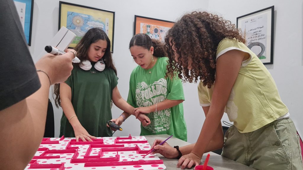 Student of Rahaal Programme helping each other to prepare and organise Al Salam Community School's breast cancer charity event, Bake Sale 2023.