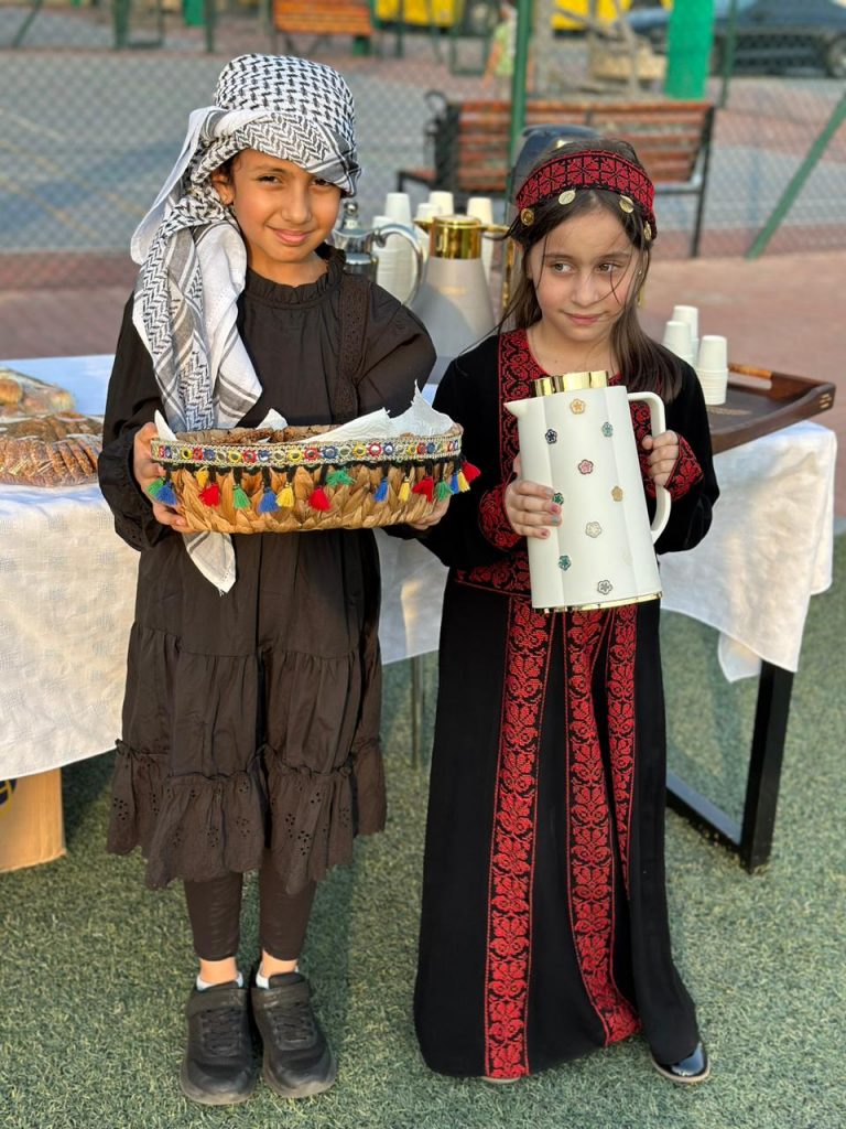 Students of Al Salam Community School in Palestinian traditional clothing at the school's fundraising event for Gaza.